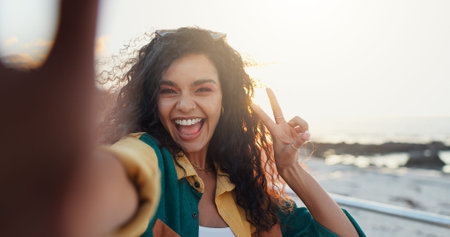 Beach, selfie and woman with peace sign, vacation and travel with profile picture, social media and...