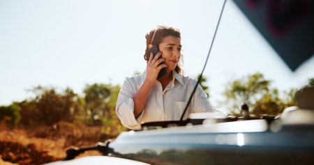 Stress, woman and phone call with car breakdown for travel crisis, accident and vehicle emergency. Person, mobile and discussion for mechanic advice, roadside assistance and update of insurance claimの写真素材