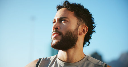 Break, runner or man in city thinking of fitness, marathon training or exercise health. Low angle,...