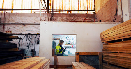 Man, tablet and wood at warehouse, scroll and industry for typing report at lumber plant. African...