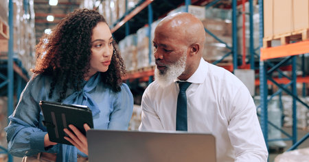 Distribution, people and tablet in warehouse, laptop and online schedule for shipping. Employees, logistics and meeting with checklist, quality control or tech for email, app and inventory managementの写真素材