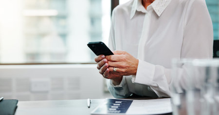 Cellphone, communication and hands of businesswoman in office for email with investor client. Phone,...