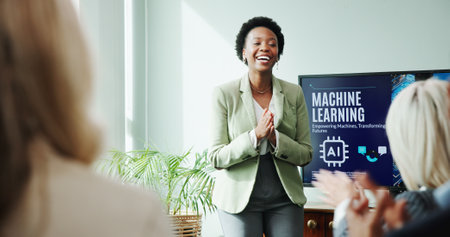 Applause, presentation and woman with smile, achievement and training for machine learning or happy. Celebration, colleagues and people with successful meeting, clapping or excited for ai in businessの写真素材