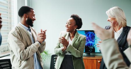 Applause, colleagues and people with smile, achievement and happiness for celebration and business. Accomplishment, excited and team with success in boardroom, collaboration and good news for groupの写真素材