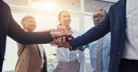 Business people, hands together and teamwork, support or collaboration with company goals, success or mission. Employees, professional group and circle with stack for job, target and staff synergyの写真素材