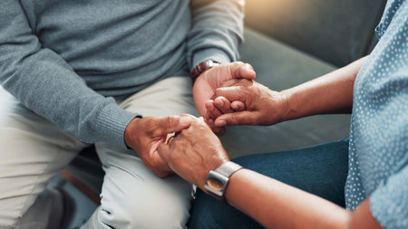 Comfort, empathy and holding hands with couple in home living room together for bonding, love or...