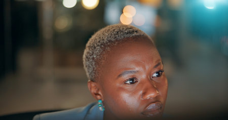 Business, black woman and thinking in office at night with publication deadline, story inspiration or article planning. Bokeh, journalist or overtime for creative process, source verification or blogの写真素材