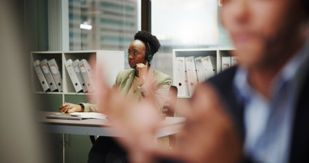 Woman, call center and coworking office for contact us, communication or telecom agency with customer service. Consultant, colleague and CRM for help desk, support or advice with agent in workplaceの写真素材