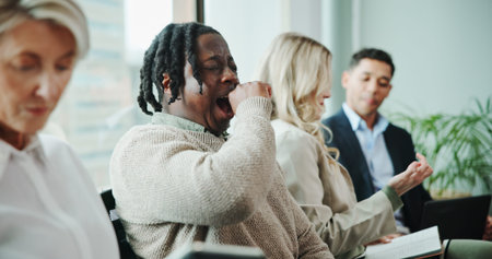 Interview, yawning or tired businessman in waiting room for hiring or human resources. Resume,...