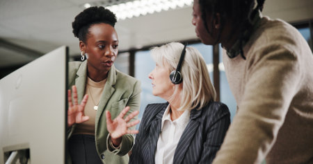 Call center, team and people training with mentor for customer service, collaboration or sales advice. Group, contact us and telemarketing manager on computer for discussion, help interns or coachingの写真素材