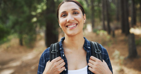 Hiking, smile and portrait of woman in forest with backpack for exercise, cardio workout and...