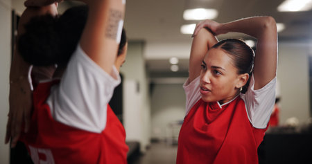 Athlete, soccer and women in locker room for stretching, preparation for match with conversation and warm up. Football player, team and people ready for tournament, competition and fitness with chatの写真素材