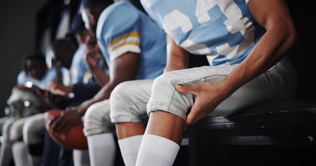 Knee pain, injury and football player in locker room for fitness accident, fibromyalgia or fracture....