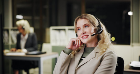 Woman, call center and coworking office at night for communication, contact us or telecom agency....