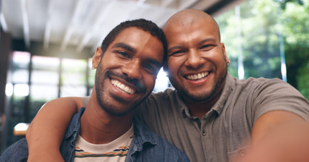 Home, selfie and gay couple with love, hug and bonding together with profile picture. Face, queer people and men with embrace, relationship and marriage with memory, kindness and romance with prideの写真素材