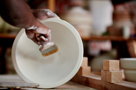 Workshop, pottery and painting of sculpture, hands and creativity for design in store and productivity. Small business, artisan and person with skills for craftsmanship, painter and color for artworkの写真素材