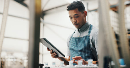 Distillery, tablet and man in factory for alcohol production, manufacturing or distribution...