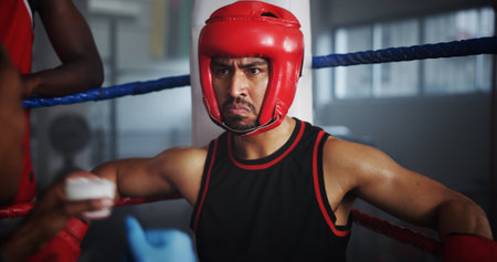 Boxer, training and man at gym for fitness, intense fight or combat skills with sports and coach. Self defense, action or energy with serious boxing, personal trainer and practice for matchの写真素材