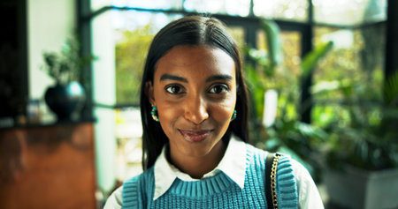 Portrait, business and happy Indian woman in office as green consultant with ambition for career....