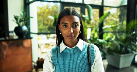 Portrait, business and Indian woman in office as green consultant with ambition for career. Pride, professional employee and confident worker with sustainability advisor or eco friendly specialistの写真素材