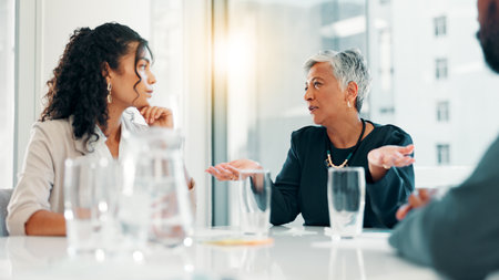 Business, people and serious with discussion in office for funding negotiation, finance pitch or budget insight. Financial team, listening and stakeholders with feedback on risk management in meetingの写真素材