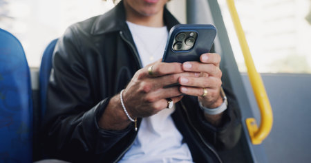 Phone, hands and man on bus online for checking university exam results on mobile app with travel. Cellphone, college and male student reading acceptance email on public transportation in city.の写真素材