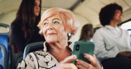 Bus, senior woman and thinking with phone for travel location, message and communication with...