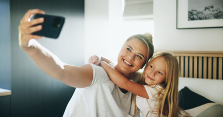 Happy mom, child and bed with hug for selfie, photography or picture together at home. Mother, kid...
