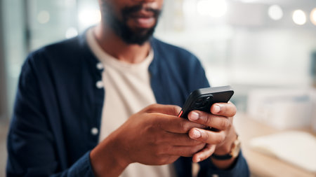 Man, hands and phone in office for business, project planning and scroll on networking platform. Employee, mobile and typing in agency for communication, email draft or browsing for productivityの写真素材