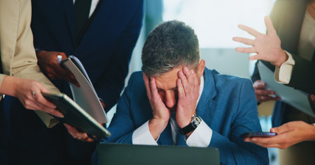 Multitasking, paperwork and businessman in office with stress, burnout or overwhelmed for deadline. Documents, chaos and male investment banker with time management for financial report with fatigue.の写真素材