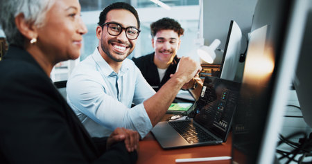 Office, teamwork and business people with laptop for coding, programming and conversation at night. Coworking, employees and programmers with tech for software update, web development and deadlineの写真素材