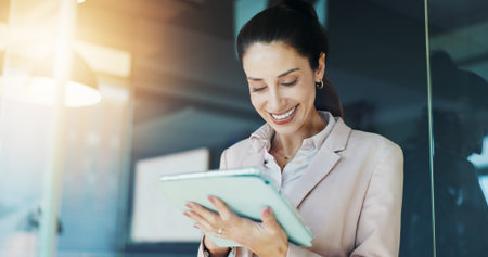 Smile, business and woman on tablet in office for research, reading email and financial report....