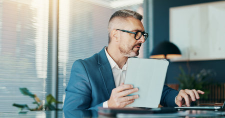 Tablet, laptop and research with business man in office for stock broker, account manager or budget report. Market monitor, trade risk and profit growth with mature person for investment planningの写真素材