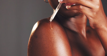 Skincare, serum and woman with product, hands and moisturizing of skin with liquid, hydration and...