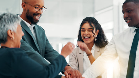 Business people, office and stack hands in team, celebration and happy with cheers, goals and diversity at agency. Group, men and women for success, synergy and collaboration at financial companyの写真素材