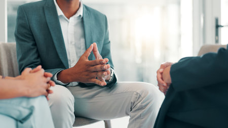 Business people, hands and HR for compliance, discussion or discipline in office. Person, meeting or complaint for bad behavior for workplace, bullying or reprimand for performance review or feedbackの写真素材