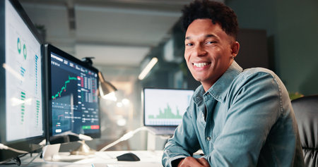 Portrait, man and computer screen for trading in office of statistics review, finance charts and stock market. Male person, graph and pc with risk analysis, financial increase and investment patternの写真素材