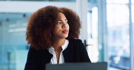 African, accountant or businesswoman on laptop with ideas for review, audit or research. Financial management, budget or investment banker thinking of solution for accounting, taxes or profit growthの写真素材
