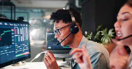 Trading call center, screen or man on computer for customer service, investment advice and market insight. Contact us, advisor and broker with client query for financial news, assistance and chartsの写真素材