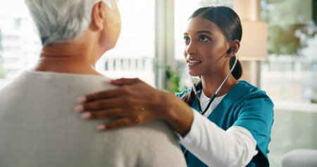 Senior patient, nurse and stethoscope with heart beat in consultation for hospital checkup, chest exam or lung test. Healthcare, professional and woman with tool to monitor BPM at medical appointmentの写真素材