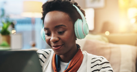 Remote work from home, headphones and black woman with laptop, copywriting and transcription...