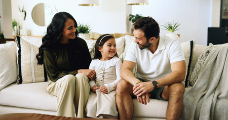Smile, happy family and parents with girl, living room and sofa with love, bonding and relax in...