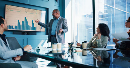 Presentation, laptop and business people in office for financial consulting, budget review and investment. Professional, corporate team and men with women for finance report, strategy and discussionの写真素材