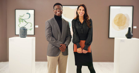Curator, collaboration and people in art gallery, smile and colleagues with pride, creative and...