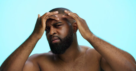 Worry, face check and skincare for man, portrait and acne treatment in morning, serious and...