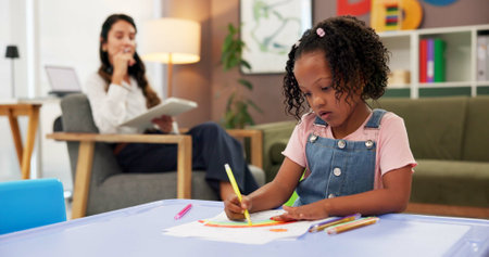 Exam, kid and drawing with woman in psychology office for consulting, child development and art therapy. Education therapist, advice and mental health evaluation with person and girl in clinicの写真素材