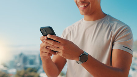 Man, hands or fitness with phone in nature for workout app, tracking performance or connection. Closeup, active or male person with smile on mobile smartphone for outdoor exercise schedule or resultsの写真素材