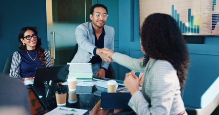 Business people, meeting and handshake with documents for analytics, partnership or deal at office....