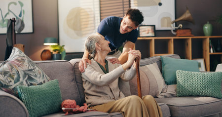 Senior woman, nurse and sofa with assisted living for healthcare service at old age home. Caregiver,...