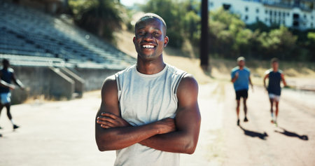 Portrait, active and black man with pride at stadium for exercise, sports training and practice on...